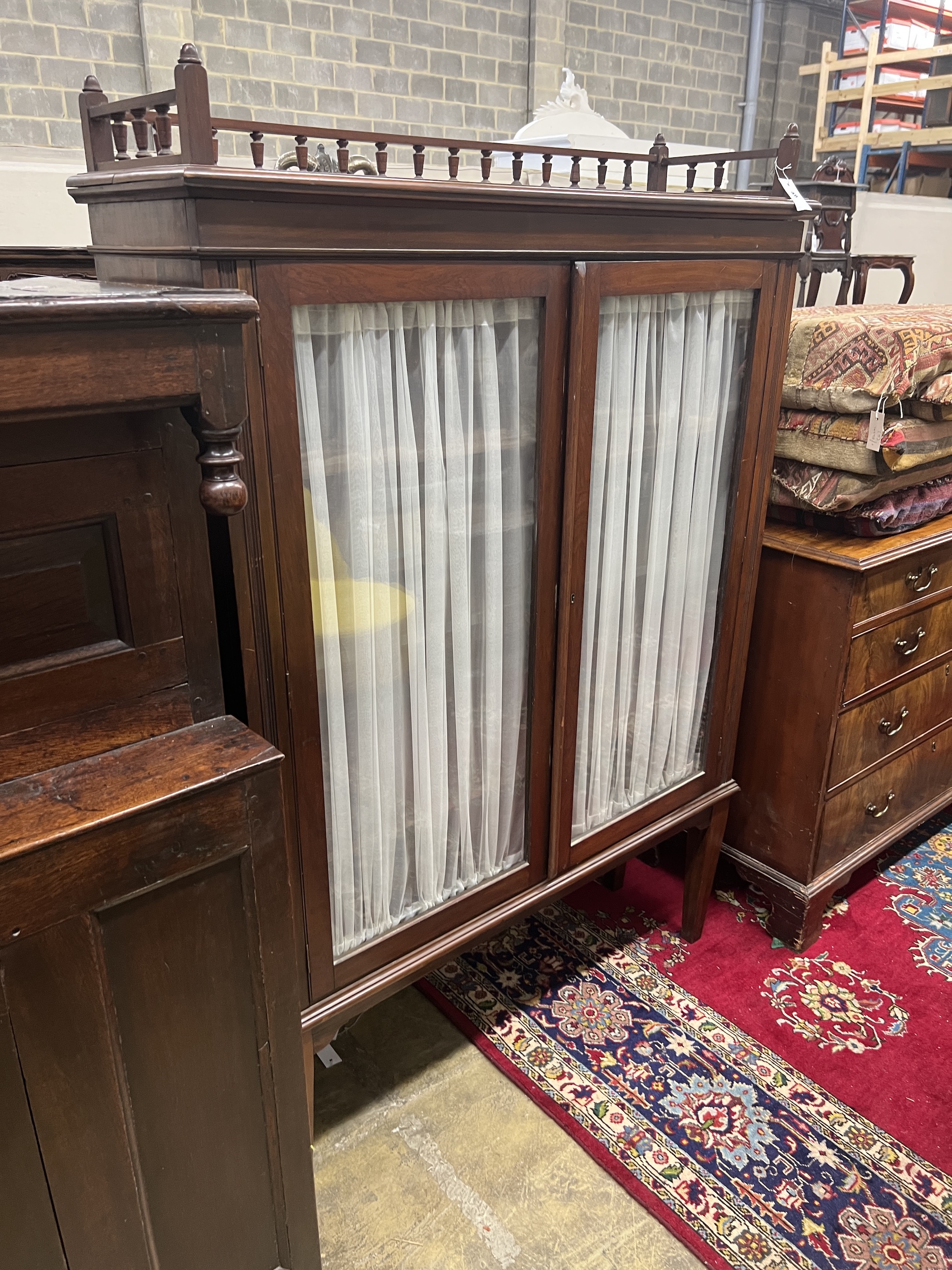 A 19th century Continental mahogany display cabinet, width 116cm, depth 35cm, height 171cm